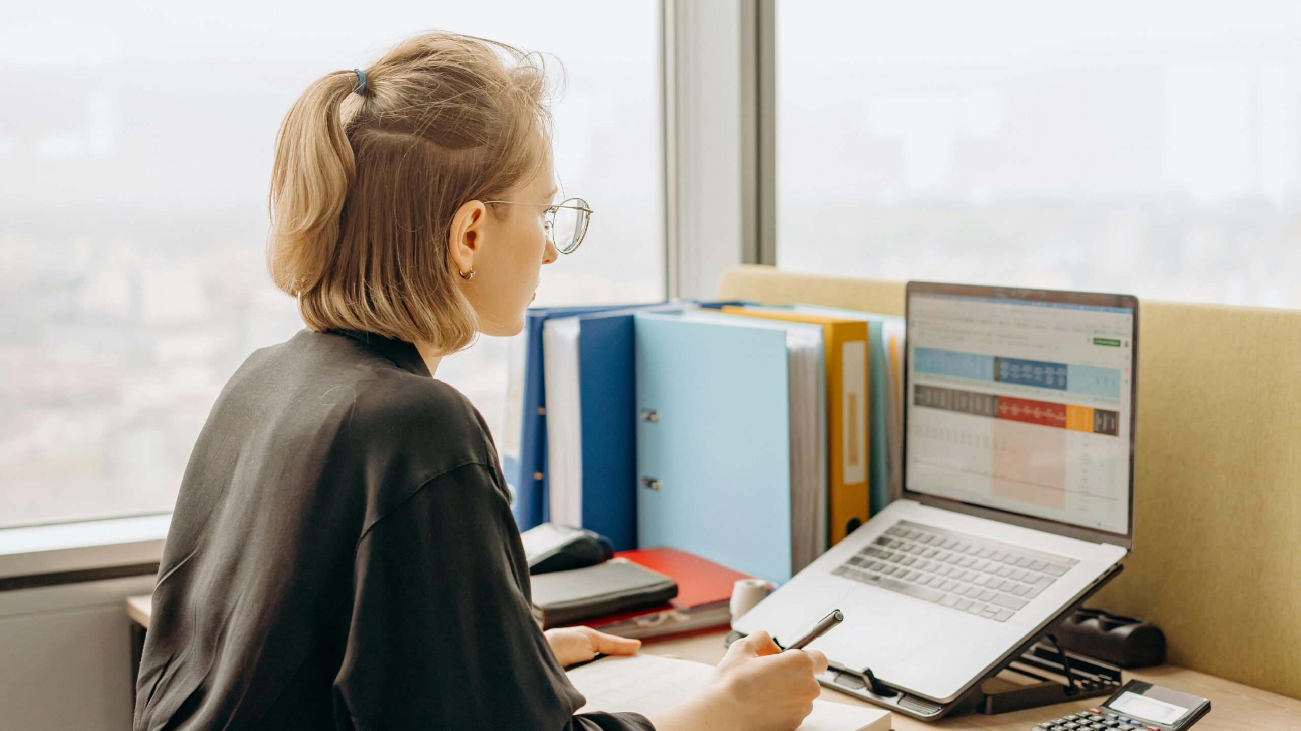 woman working with spreadsheet edited 1 scaled