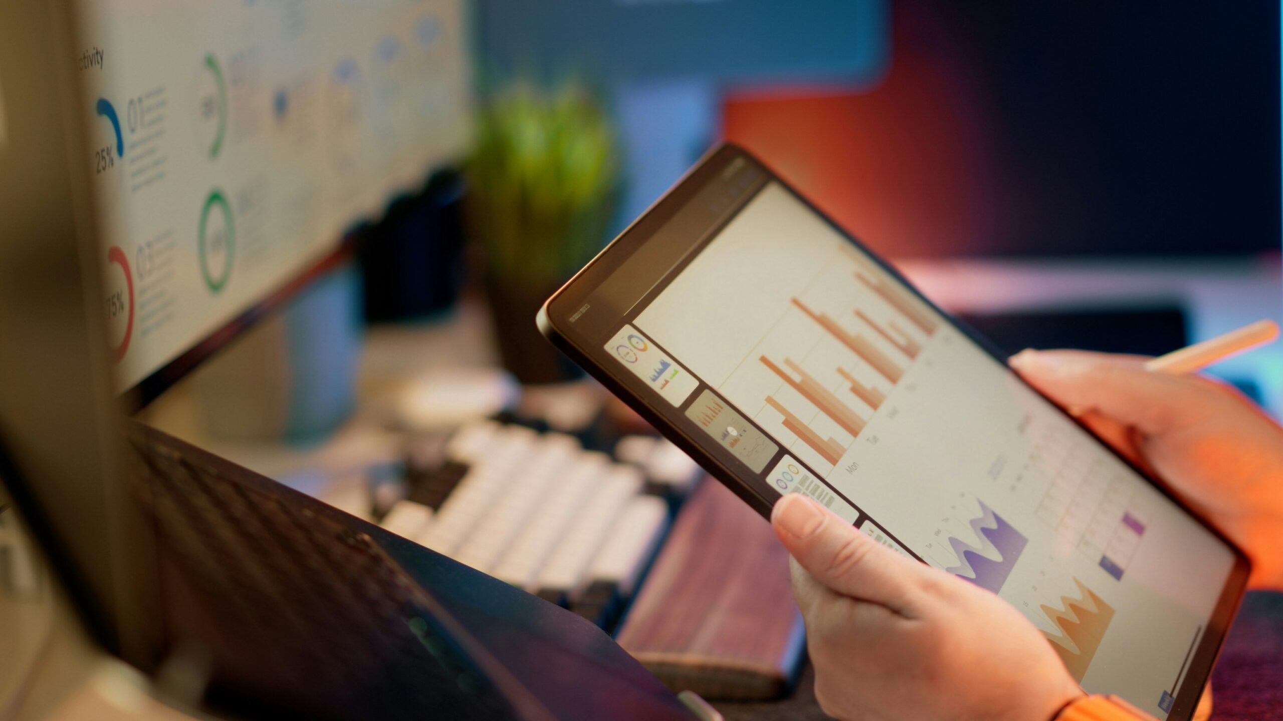 Business analyst reviewing predictive pricing analytics and performance dashboards