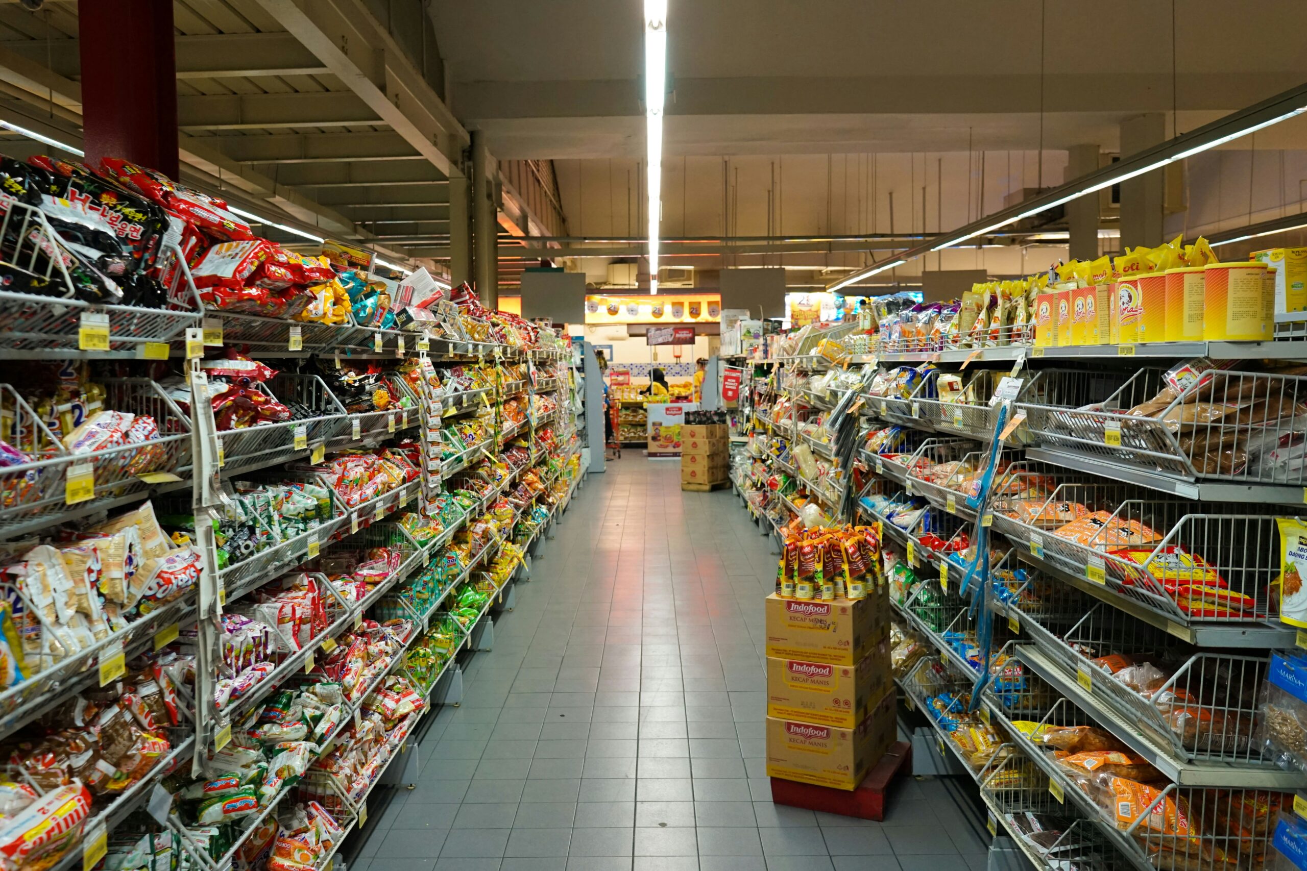 Grocery store aisle with products and promotional price tags